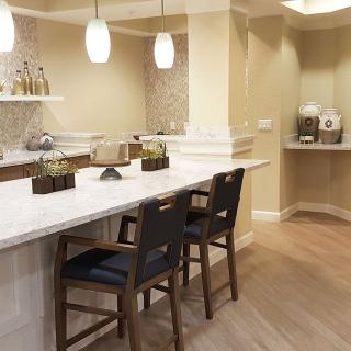 Modern kitchen interior with a stylish countertop and bar seating.