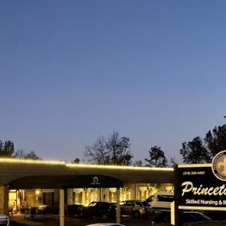 The Princeton facility illuminated under the evening sky.