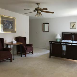 A spacious living room featuring comfortable seating and a cozy atmosphere.