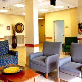 A well-furnished waiting room with comfortable seating and tasteful decor.