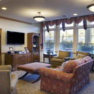 A cozy living room with comfortable seating and natural light.
