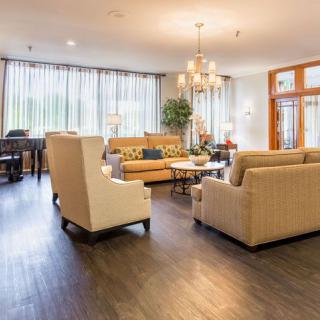 A spacious living room with elegant furniture and a cozy ambiance.