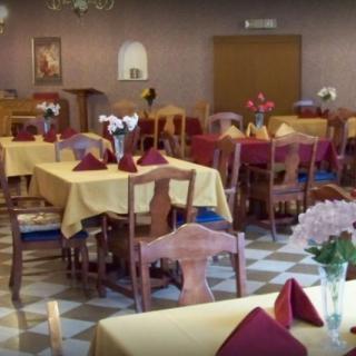 A well-arranged dining room with tables set for guests.
