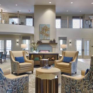 A modern and cozy living room with comfortable seating and elegant decor.