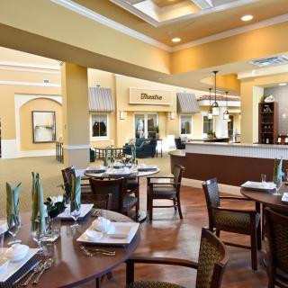 An elegantly designed restaurant dining area with neatly arranged tables and stylish interior.
