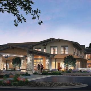 A beautifully designed residential building, showcasing modern architecture in the evening light.