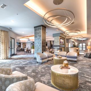 A luxurious and modern hotel lobby with comfortable seating and elegant lighting.