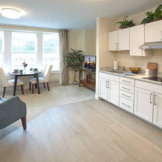 A bright and modern open-concept living area with a kitchen and dining space.