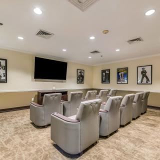 A cozy home theater setup with comfortable seating and movie-themed decor.
