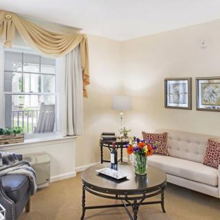A cozy living room with elegant furnishings and decor.
