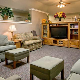 A cozy living room with comfortable seating and a television.