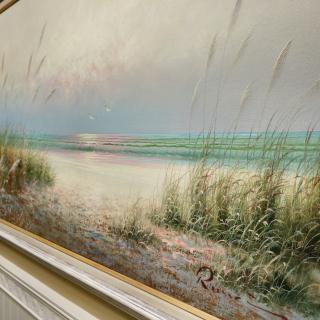 A serene painting of a coastal landscape with sandy dunes and gentle waves.