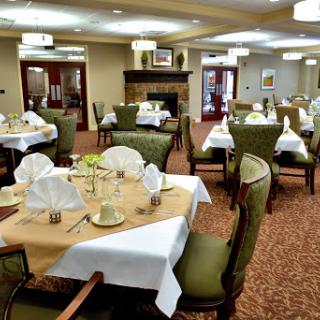 A beautifully arranged dining room featuring elegantly set tables.