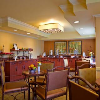 A cozy dining area featuring a buffet setup with elegant decor.