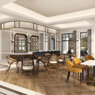 A modern and elegantly designed dining area with stylish furniture.
