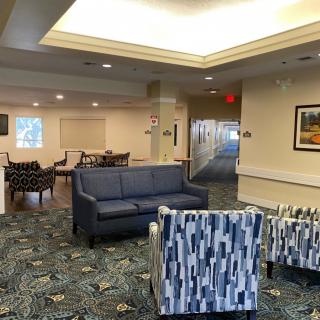 A cozy lobby area with comfortable seating and soft lighting.