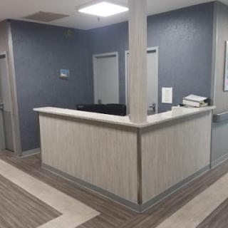 A modern and minimalistic reception area in a healthcare facility.