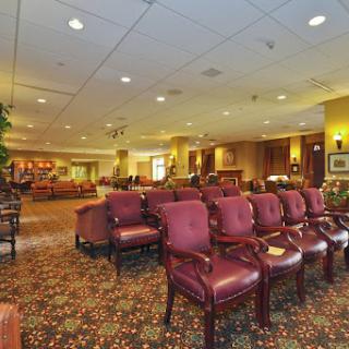 A cozy waiting area featuring elegant seating and warm lighting.