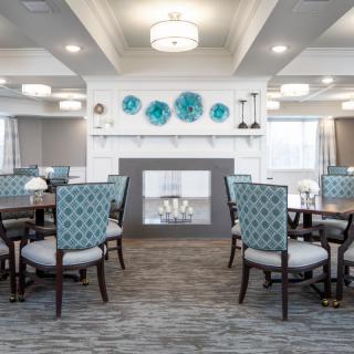 A modern dining area with elegant decor and comfortable seating.