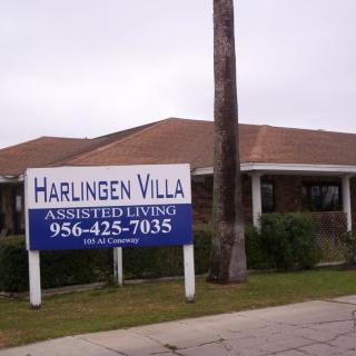 An image of the Harlingen Villa Assisted Living facility with a visible sign and building exterior.