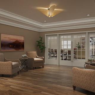 A cozy living room with elegant furniture and warm lighting.