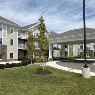 A modern residential complex featuring landscaped grounds and contemporary architecture.