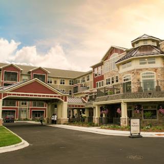 A beautifully designed hotel or residential building capturing the essence of modern architecture against a vibrant sky.