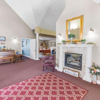 A cozy and inviting living room featuring a stylish fireplace and elegant decor.