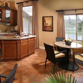 Cozy kitchen and dining area with warm wood tones and natural light.
