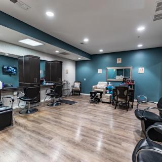 Modern salon interior with styling chairs and mirrors.