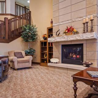 Cozy living room with a warm fireplace and comfortable seating.