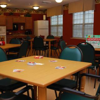 A community dining area with tables set up for card games.