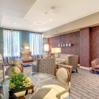 A modern living room interior with comfortable seating and elegant decor.