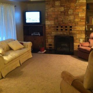 Cozy living room with a fireplace and comfortable seating.
