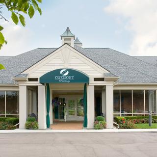 Front view of a commercial building entrance with signage.