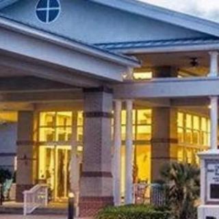 Illuminated building entrance during the evening.