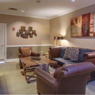 A cozy living room with comfortable seating and stylish decor.