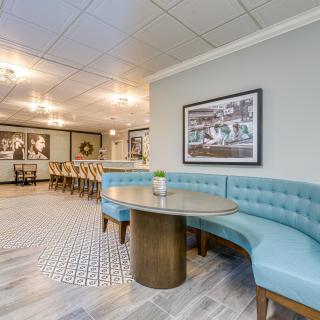 A modern dining area with booth seating and stylish decor.