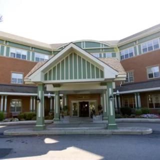 A view of a multi-story building with a prominent entrance.