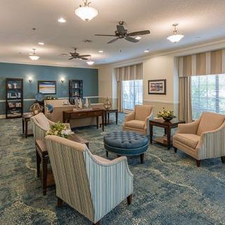 A cozy lounge area with comfortable seating and elegant decor.
