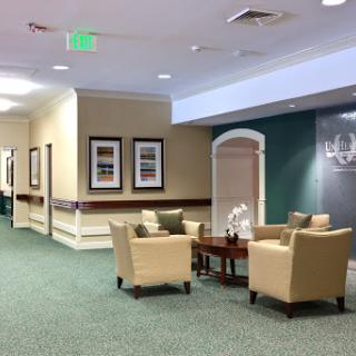 A welcoming lobby with comfortable seating and decorative artwork, perfect for relaxation.