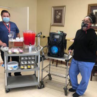 Healthcare workers providing refreshments and support in a medical setting.