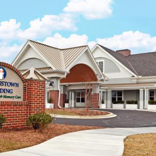 A healthcare facility with a welcoming entrance and landscaped surroundings.