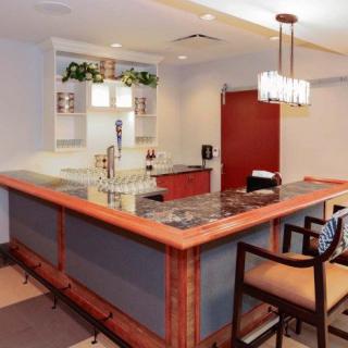 A cozy indoor bar setup with a countertop and seating.