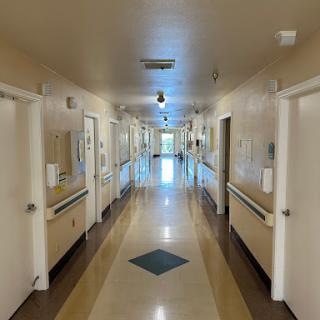 A view of a quiet hospital corridor.