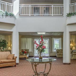 A spacious lobby with comfortable seating and elegant decor.
