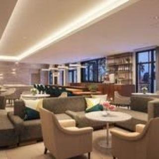 A modern lounge area with comfortable seating and ambient lighting.