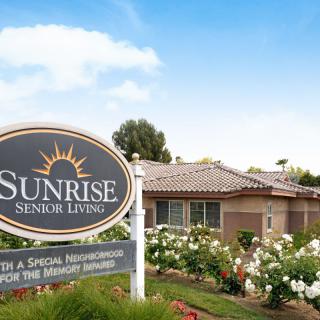 Sunrise Senior Living facility with a landscaped garden.