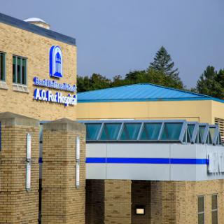 A view of a hospital building showcasing its modern architecture.