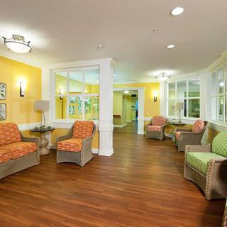 A bright and cozy living room with comfortable seating and warm lighting.